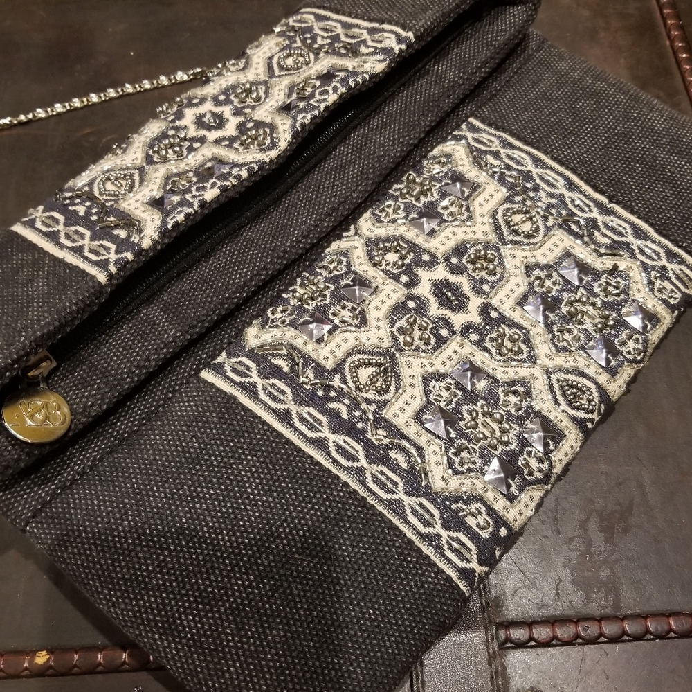 Above & Beyond clutch